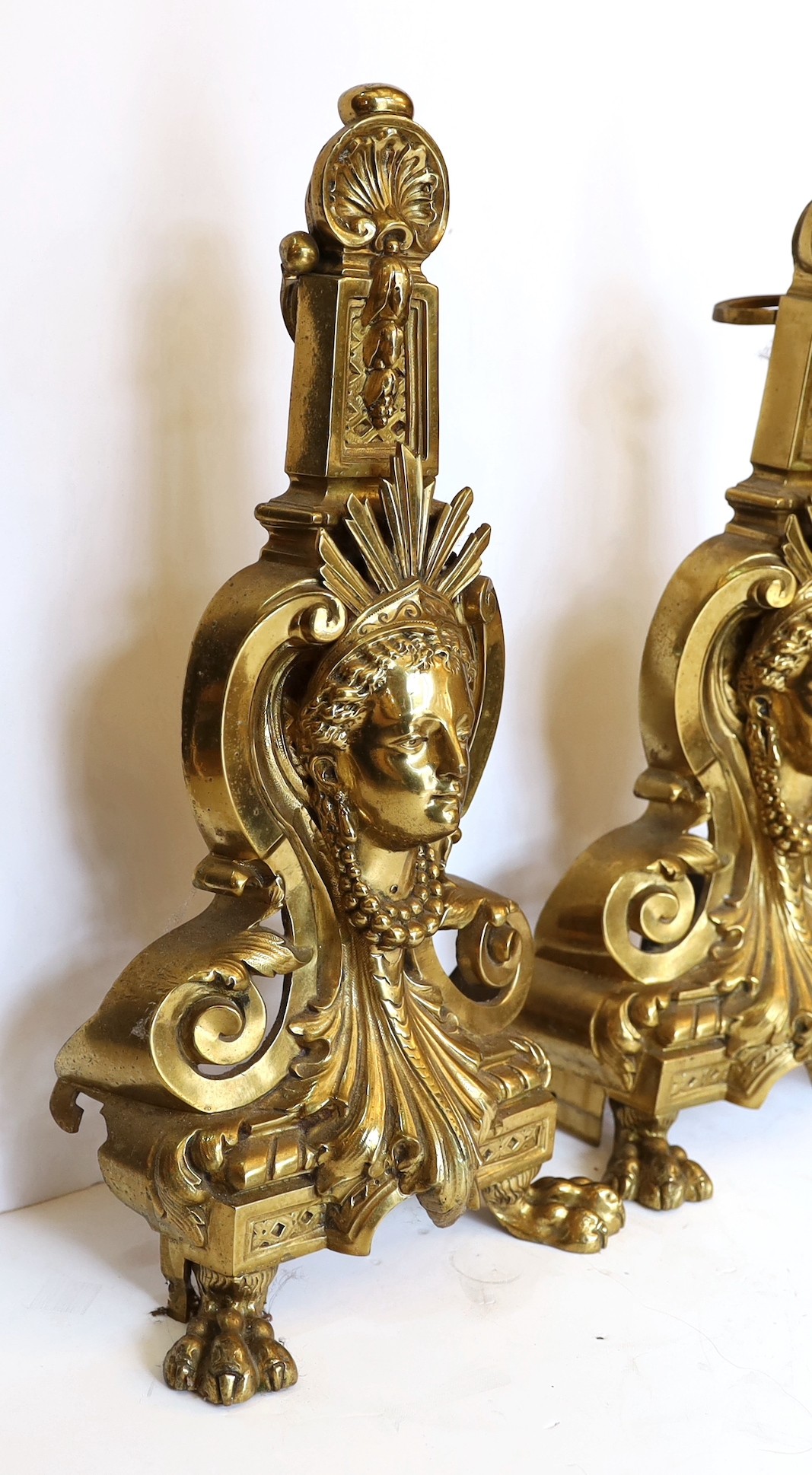 A pair of Louis XVI style gilt brass chenets, height 43cm